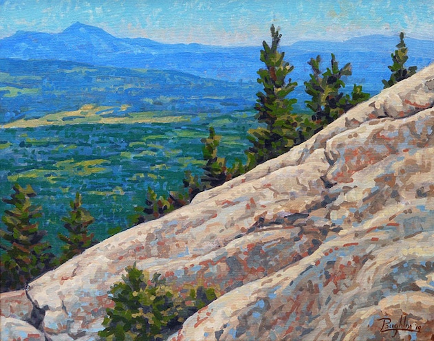 Dramatically sloping foregound frames  distant mountains