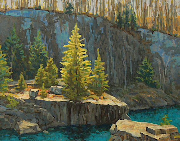 Abandoned quarry in deep shadow illuminated by dramatic light